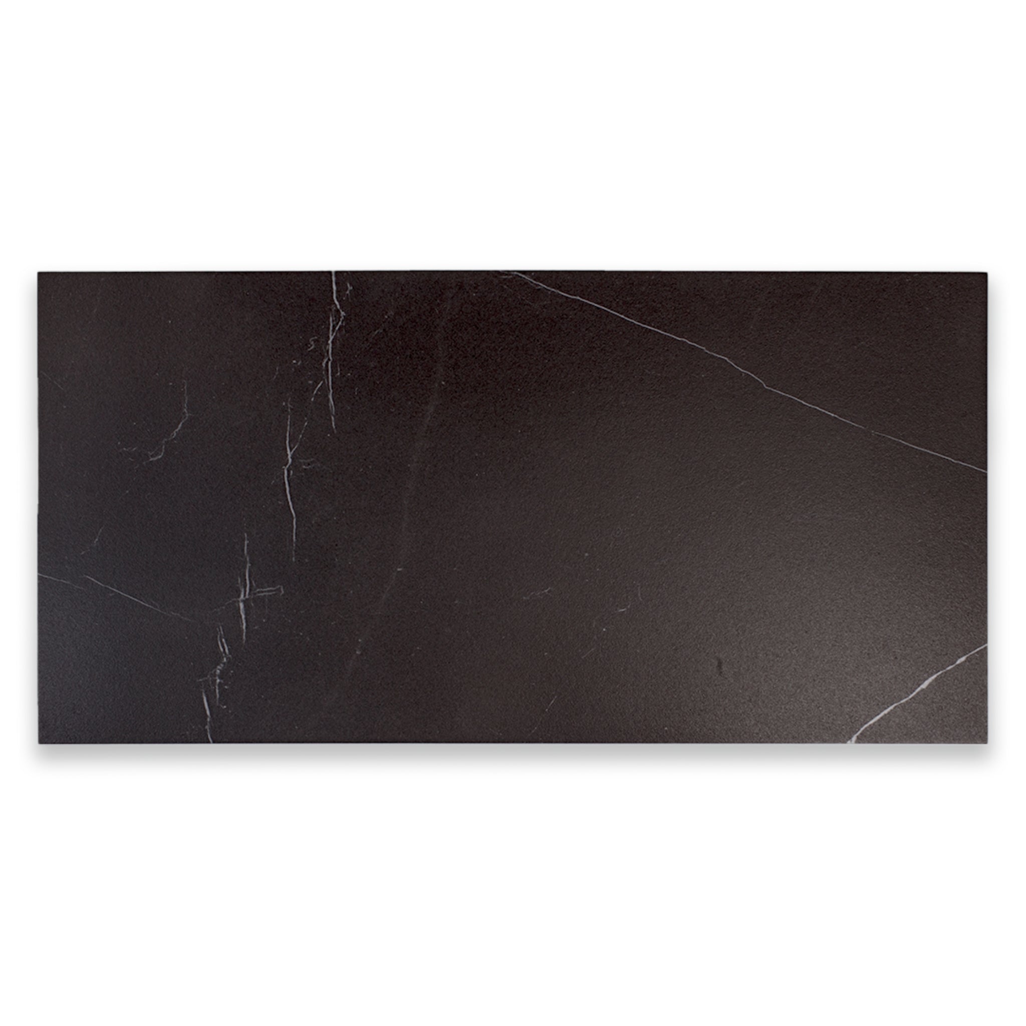 Ariel view of a single 12x24 tile in matte black marble look porcelain with white veining. 