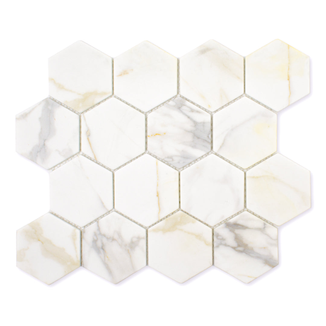 Ariel view of a loose sheet of white and grey and golden veining marble look porcelain 3 inch hexagon mosaic tiles.