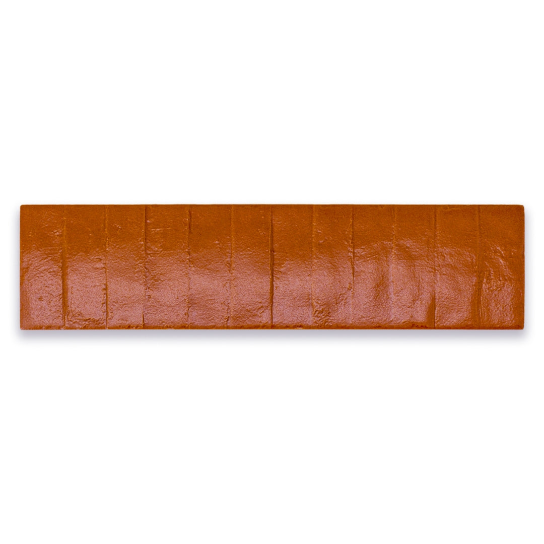 Ariel view of a single 3x12 textured pumpkin orange tile.