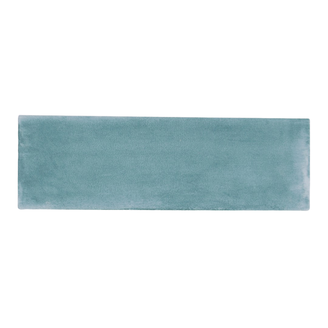 A single 2x6.5 aqua watery blue matte subway bars tile. 