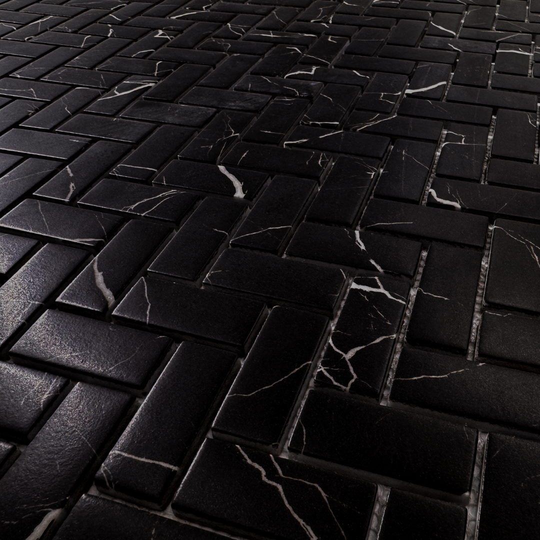 Angled close up of black marquina marble look 1x3 herringbone mosaic sheet tiles to show the deep colour, marble veining and finish. 